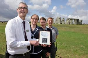 Karin Gidlund, from CIE Tours International (centre left), hands over the award to Jon Bichener, Stonehenge retail manager (left) and Stonehenge property supervisors Anneka Harris (centre right) and Kevin Barber (right).